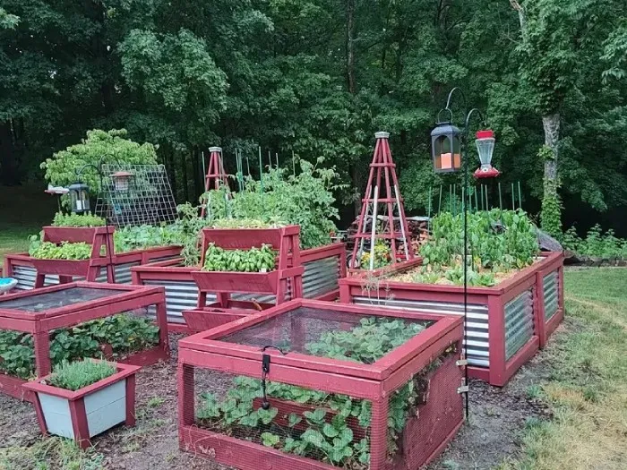 Homestead garden with outdoor wood crafts at Brookside Farm in Southborough MA